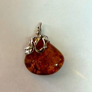 Large Citrine pendant set in silver.